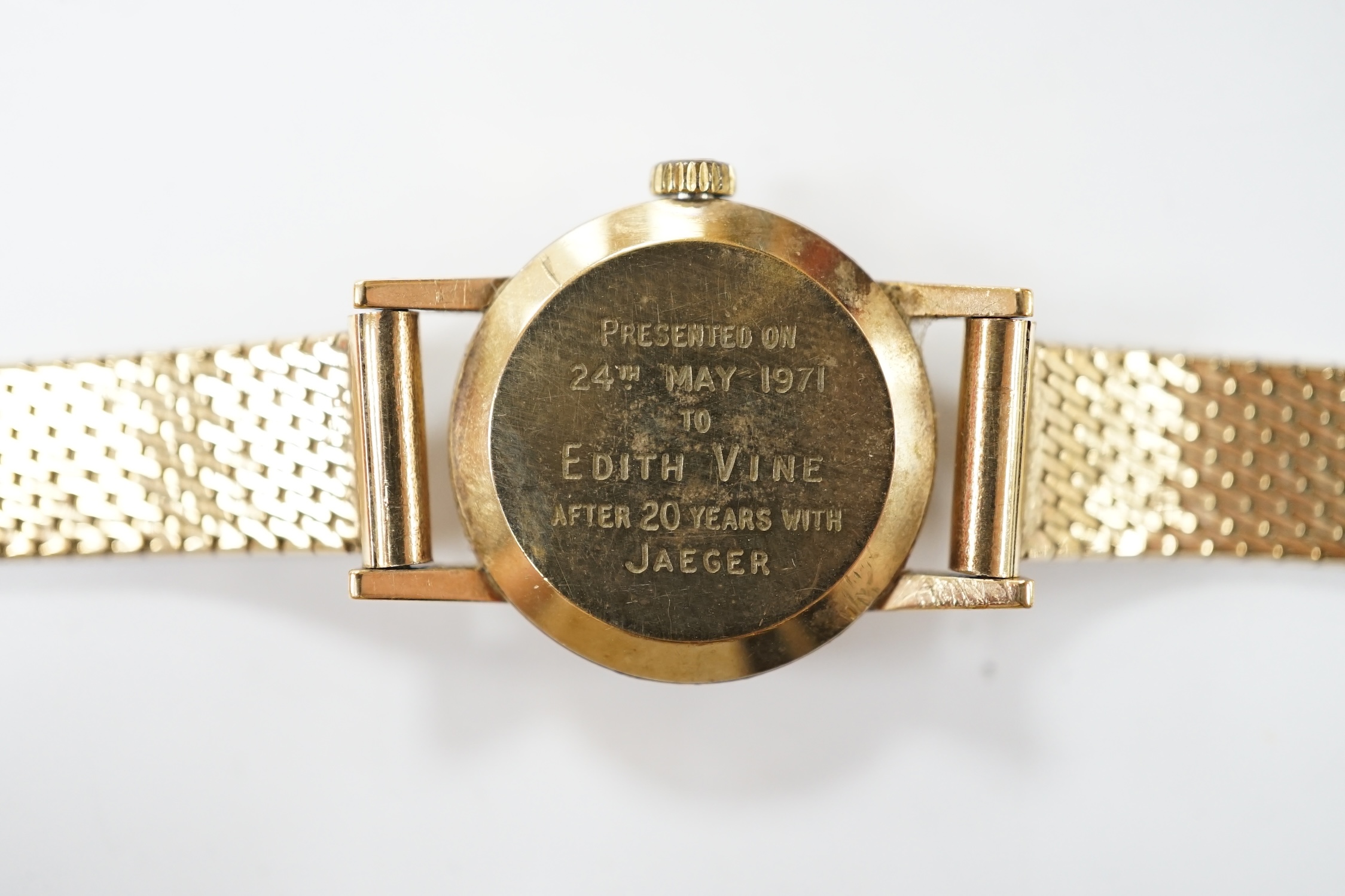 A lady's modern 9ct gold Omega manual wind wrist watch, on an associated 9ct gold bracelet, overall 18cm, gross weight 21.8 grams. Condition - fair